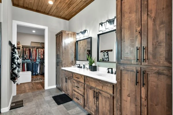 Conroe Ranch Style Barndominium Home Builder with master bath double vanity